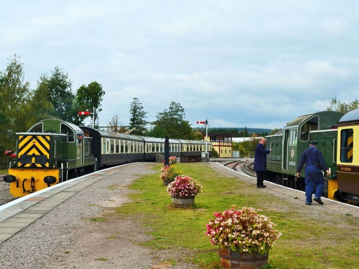 a yellow train parked at a park