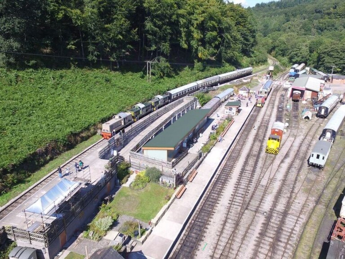 a train is parked on the side of a road