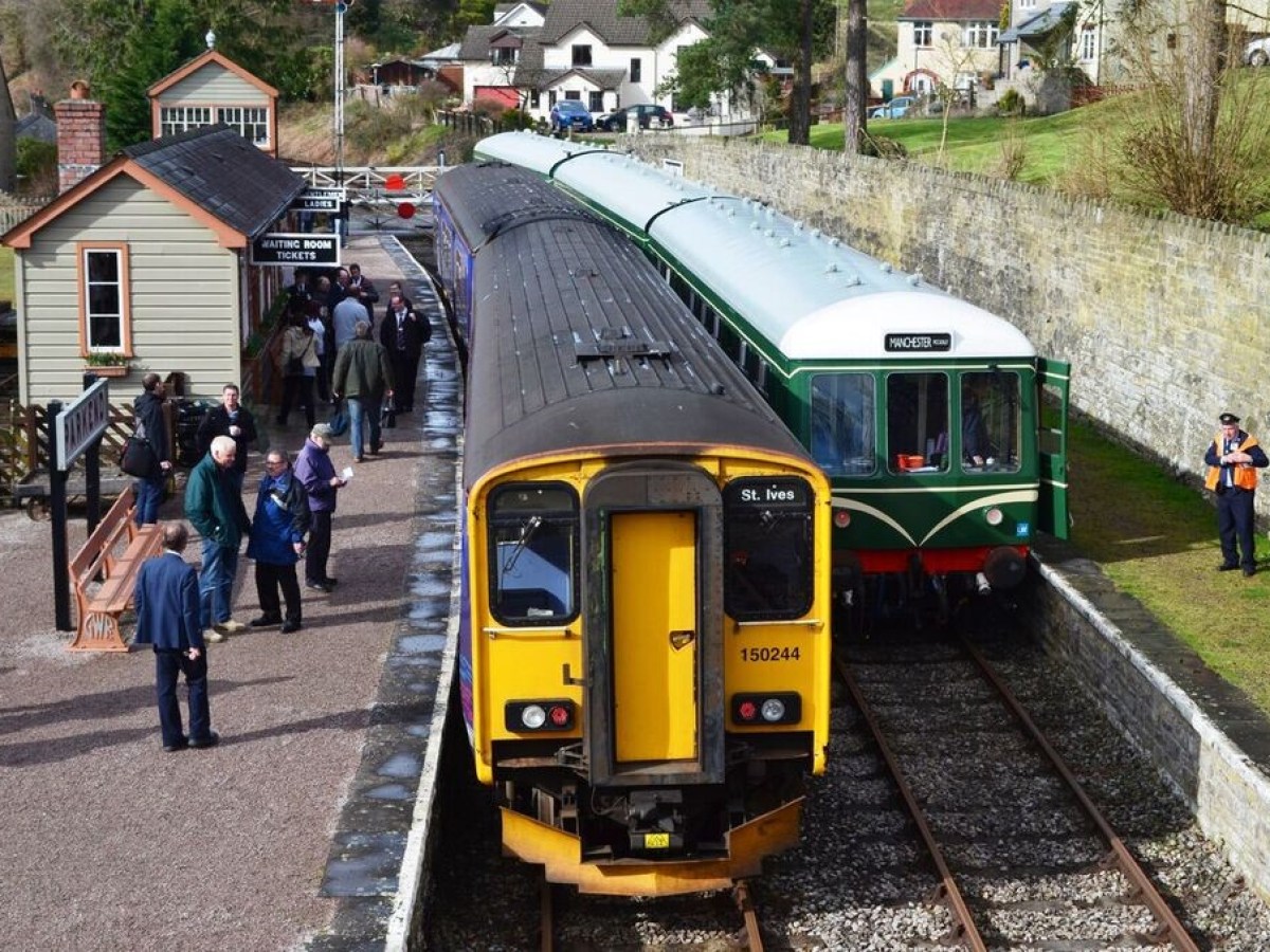 a group of people sitting at a train station