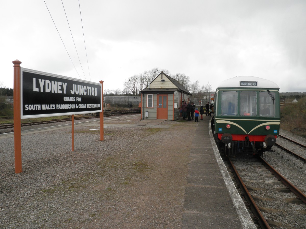 OLYMPUS DIGITAL CAMERA a train is parked on the side of the road