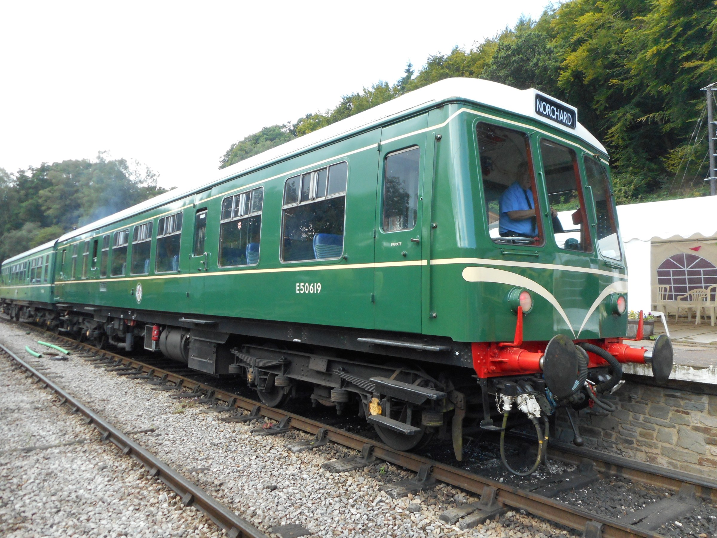 50619_Norchard_07082019 a green train that is sitting on a track