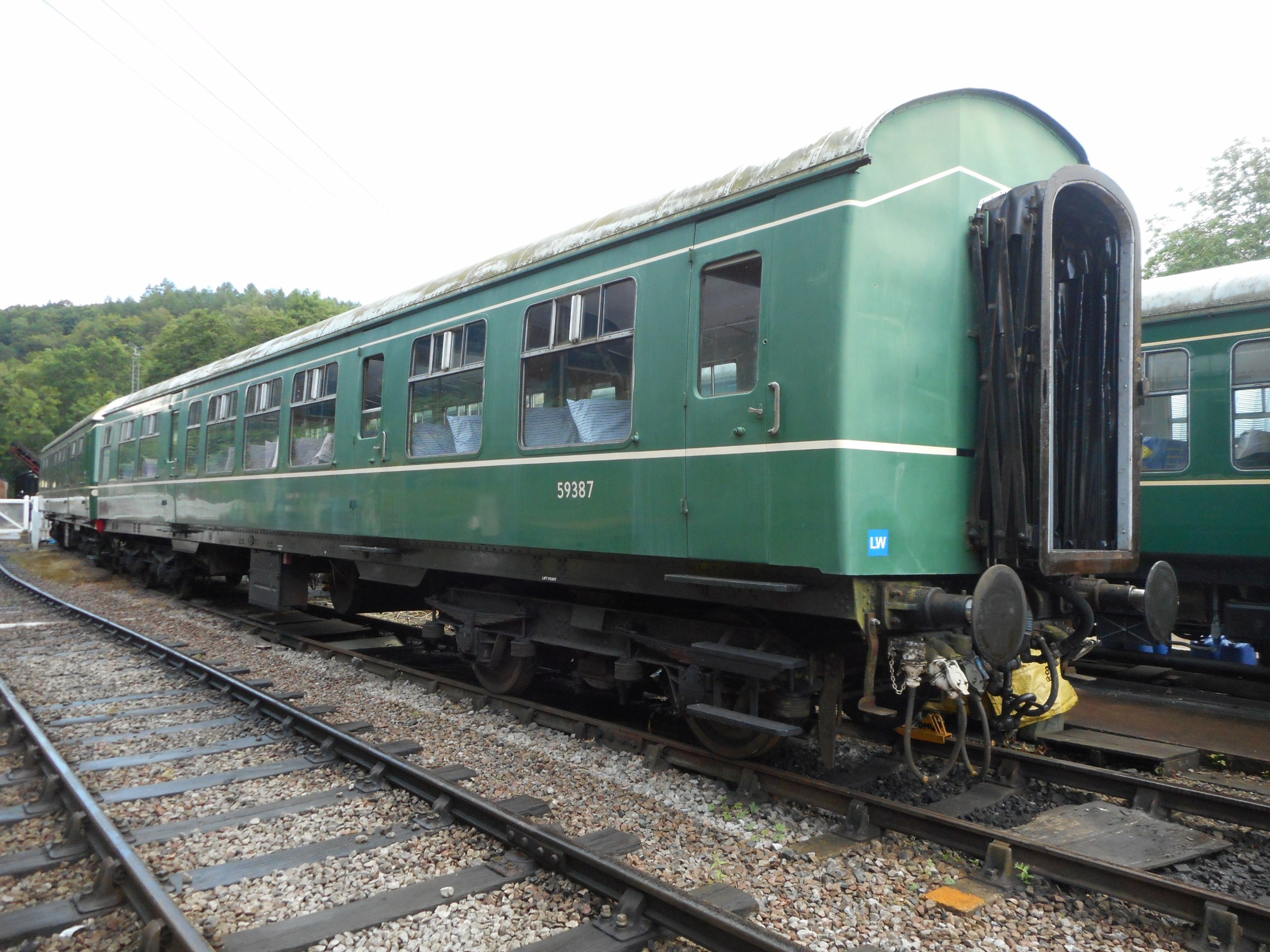 59387_Norchard_07082019 a green train that is sitting on a track