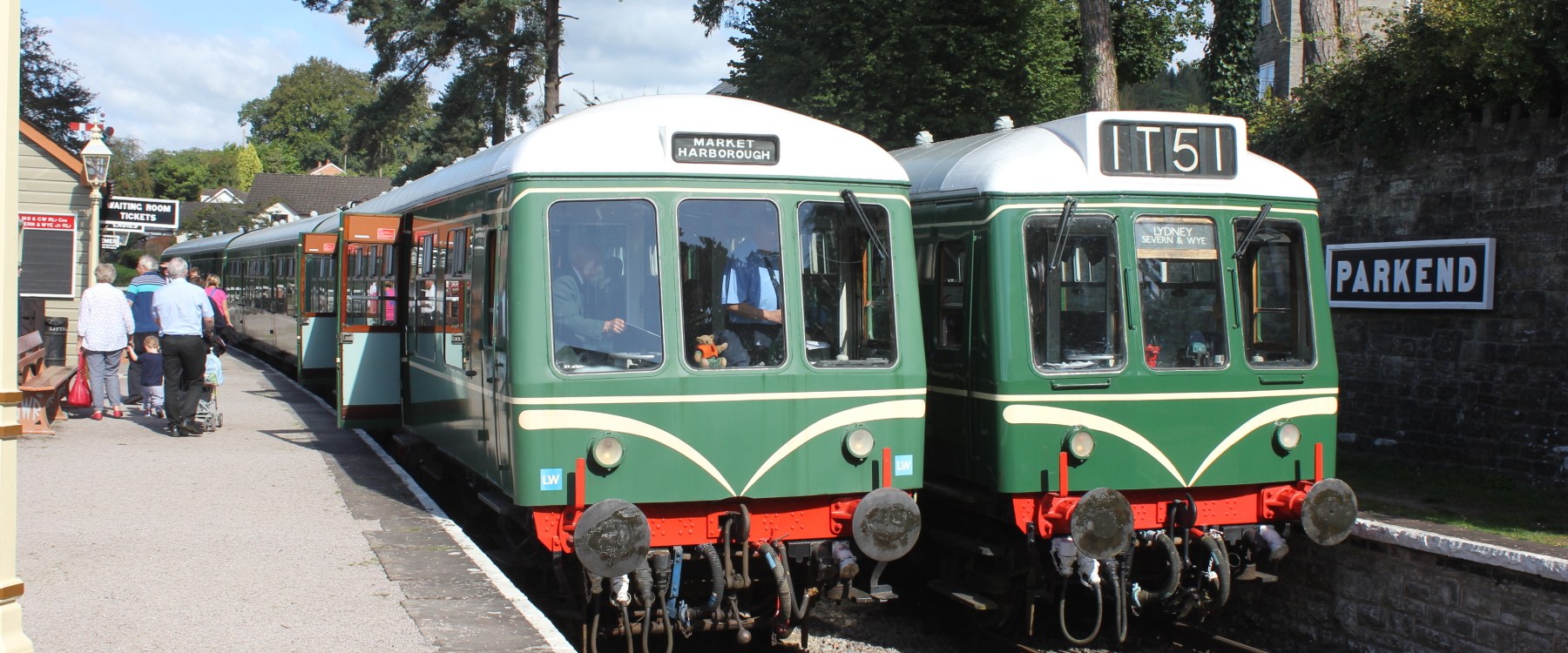 a group of people sitting at a train station